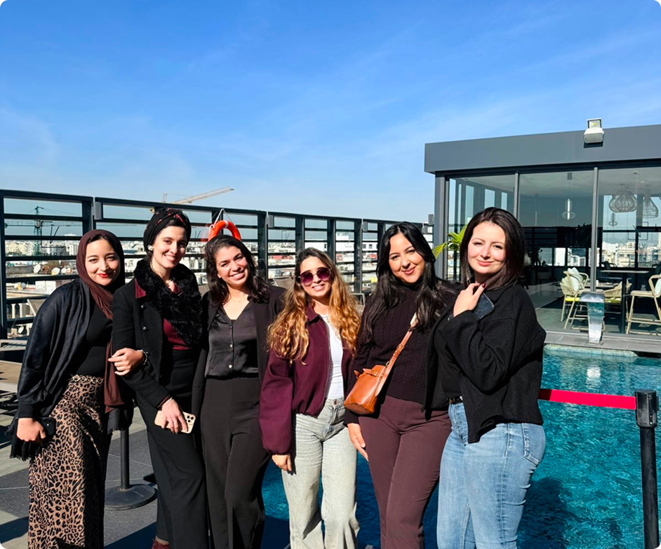 Girls by a swimming pool